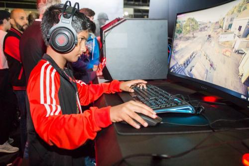 Young child enjoying games on an HP OMEN gaming notebook.